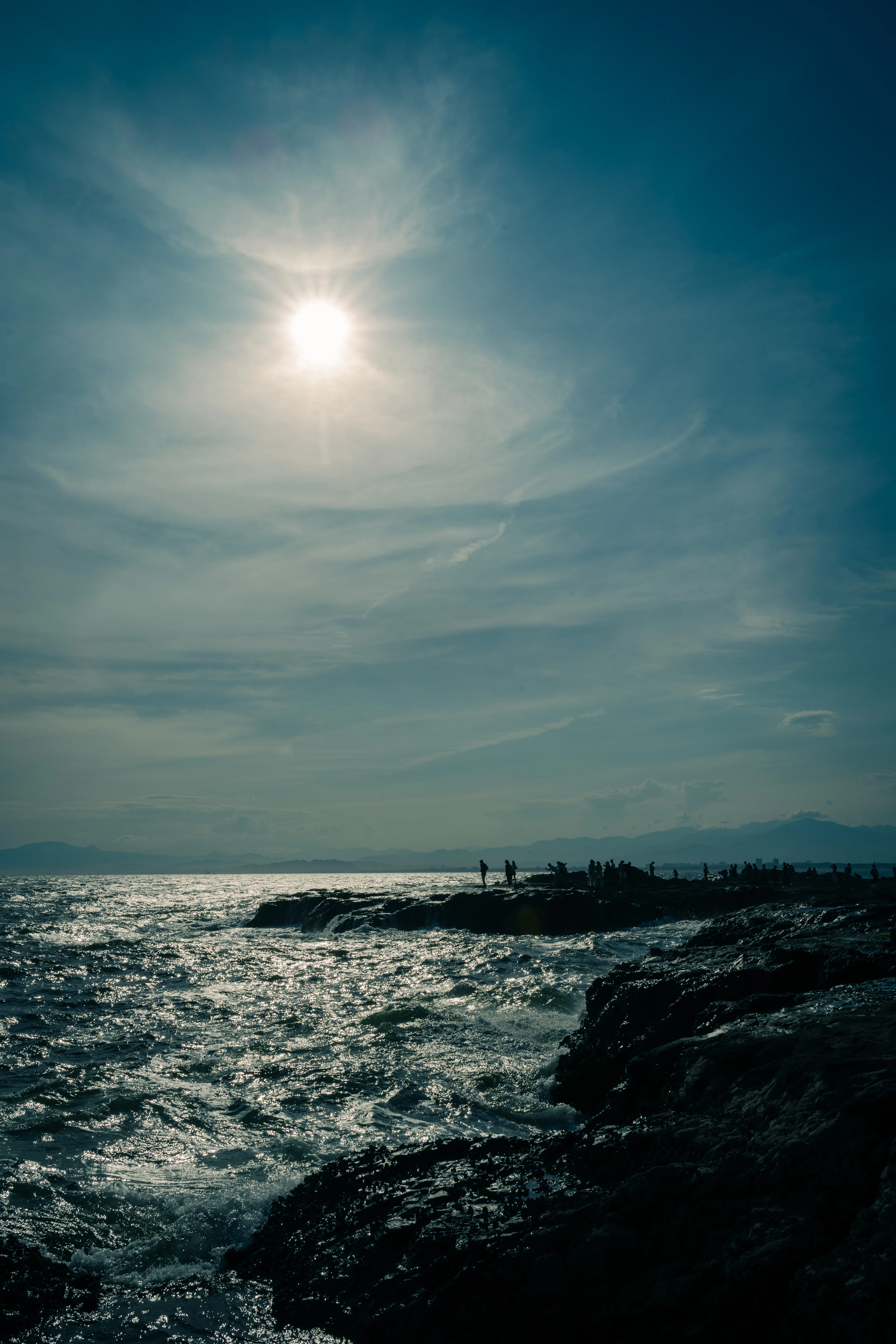 Shimmering Coastal Silhouette Under the Radiant Sun